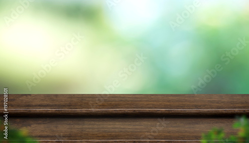 Empty step wood table top with blur tree in park with bokeh light at background,Mock up template for display of your design,Banner for advertise of product,panorama view