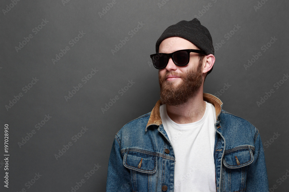 Hipster with beard wearing sunglasses and casual clothes