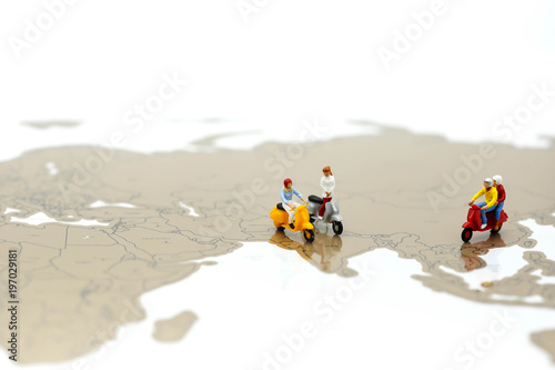 Miniature people : people on scooter with world map,Travel concept.