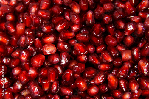 Food background of the fresh ripe pomegranate seeds
