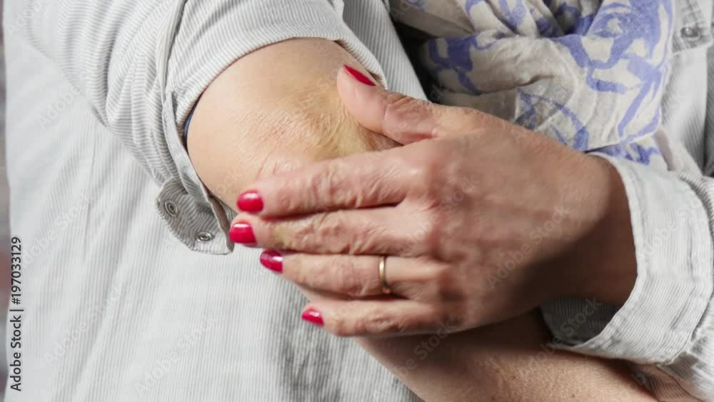 woman with elbow pain, close up woman with elbow pain, close up