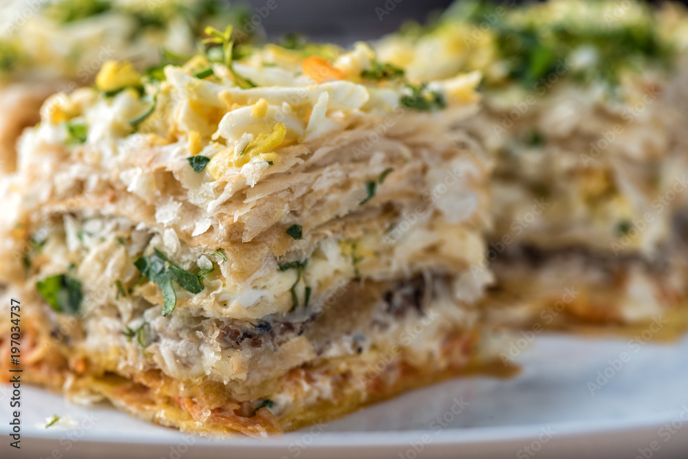 Fish pie with a dough, egg and fresh herbs, macro Fish pie with a dough, egg and fresh herbs, macro