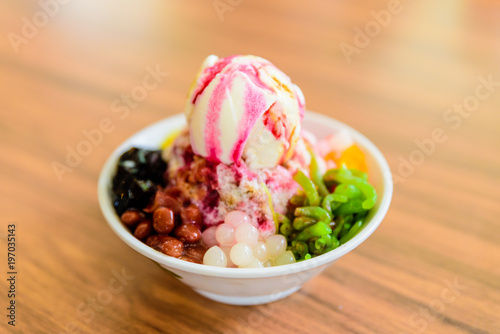 Soft focus of Ais Kacang topped with basil seeds, peanuts, corn, and a scoop of ice cream. Ice kacang literally meaning 