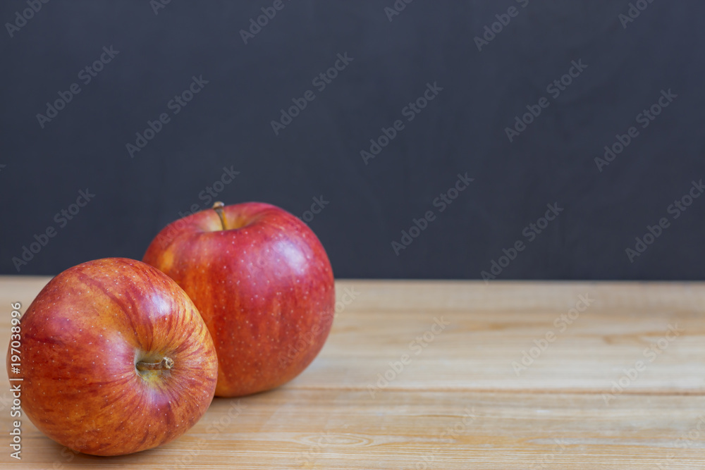 Two apples on wooden table. Back to school. Education background concept with copyspace. Two apples on wooden table. Back to school. Education background concept with copyspace.