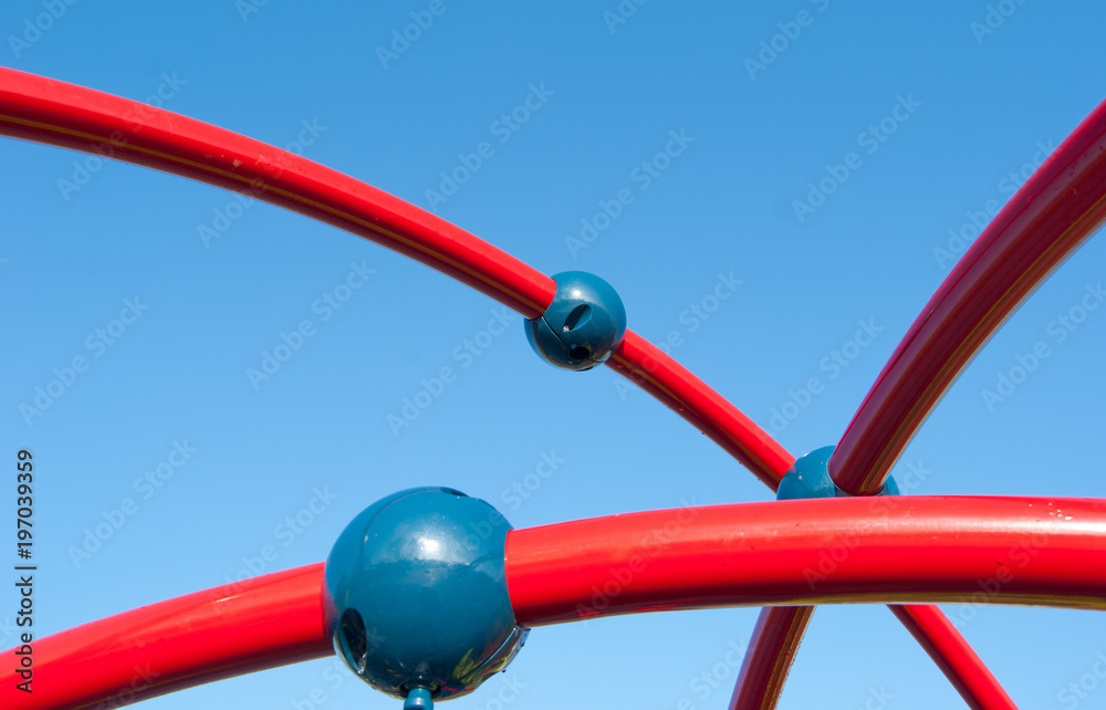 Air red play lines with three blue balls for child in a italian playground