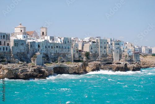 Coastal view of Polignano a Mare with rough sea and typical white houses - Puglia - Italy