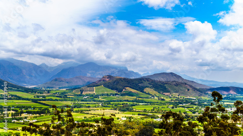 Franschhoek Valley in the Western Cape province of South Africa with its many vineyards that are part of the Cape Winelands, surrounded by the Drakenstein mountain range, as seen from Franschhoek Pass photo