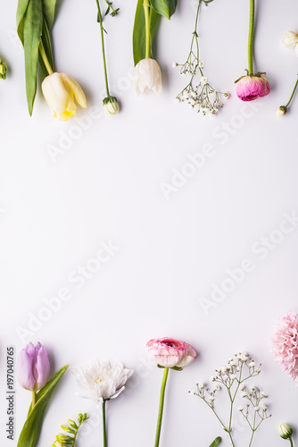 Fototapeta Naklejka Na Ścianę i Meble -  Flowers on a white background. Flat lay. Copy space.
