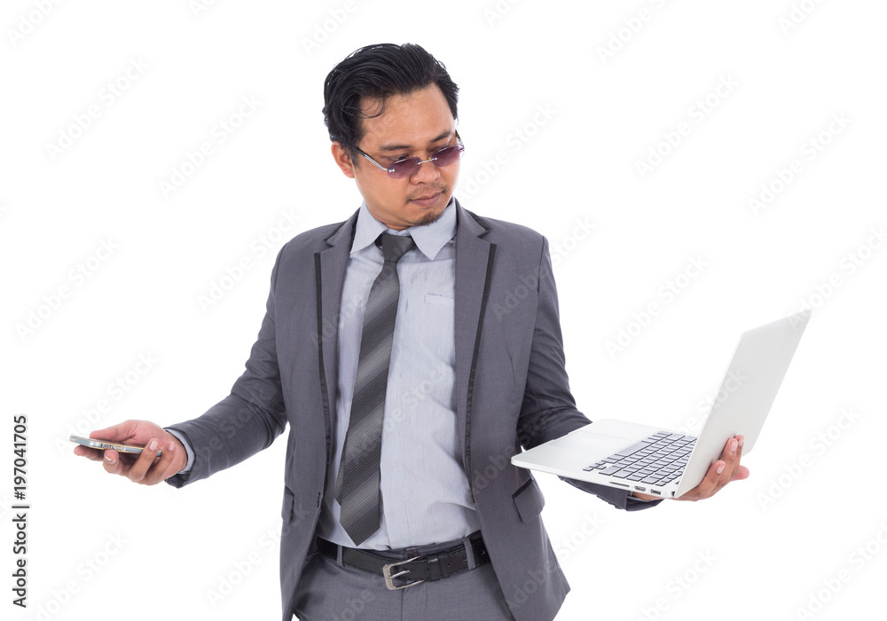 business man holding mobile phone and laptop isolated on white background business man holding mobile phone and laptop isolated on white background
