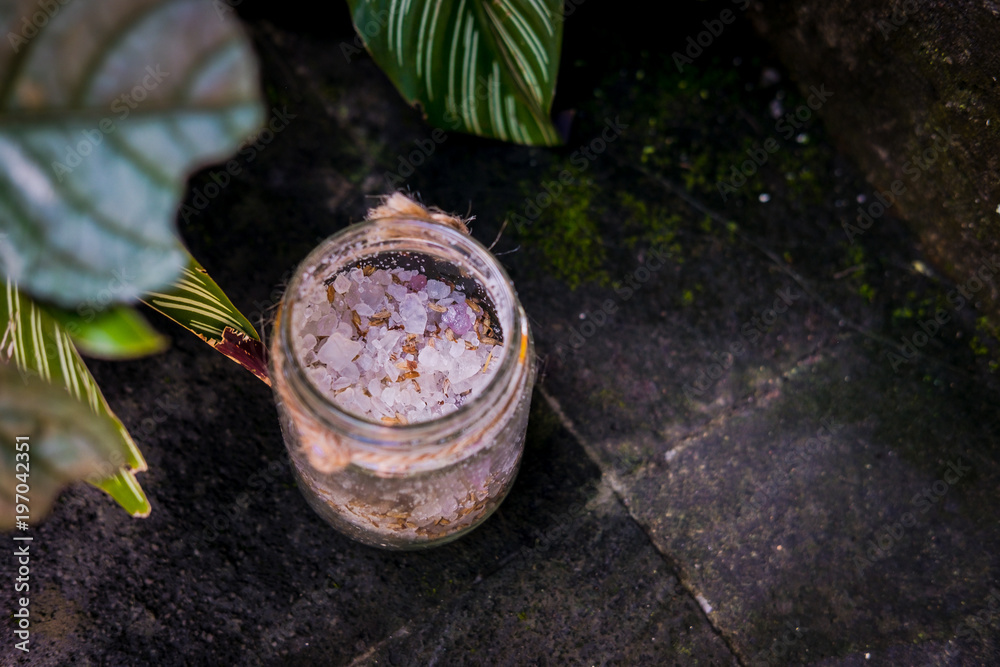 Lavender sea salt jar from above. Woman's spa natural beauty product, relaxing aroma massage treatment. Lavender sea salt jar from above. Woman's spa natural beauty product, relaxing aroma massage treatment.