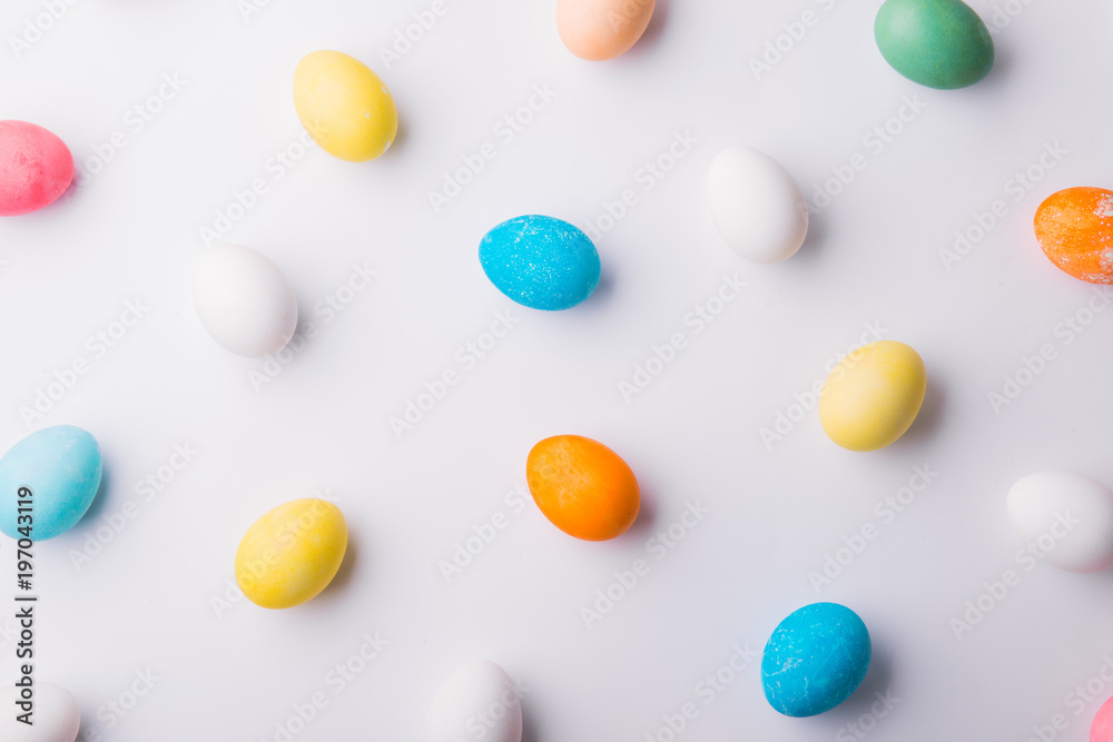 Eggs flat lay on a white background. Easter and spring composition. Eggs flat lay on a white background. Easter and spring composition.