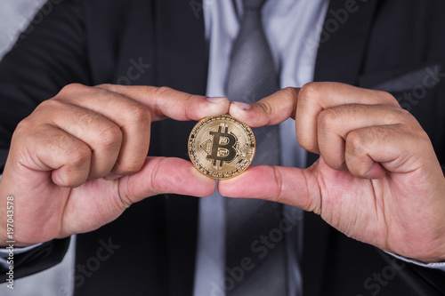 bitcoin in hand of business man