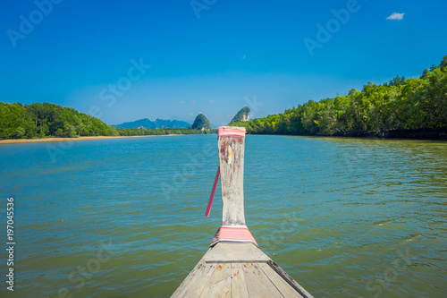 Outdoor view of traditional long tail boat on the way in Krabi town, at Southern Thailand photo