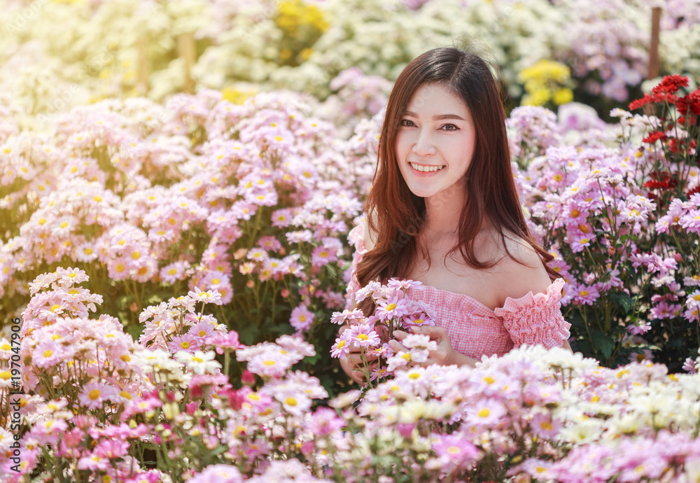 beautiful woman in chrysanthemum glower garden beautiful woman in chrysanthemum glower garden