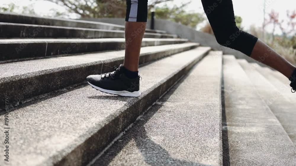 Young man runner at running for healthy.Running is an exercise as simple in order to make health of strong, Good health can not be traded,The man with runner up on stairs and running for exercise.