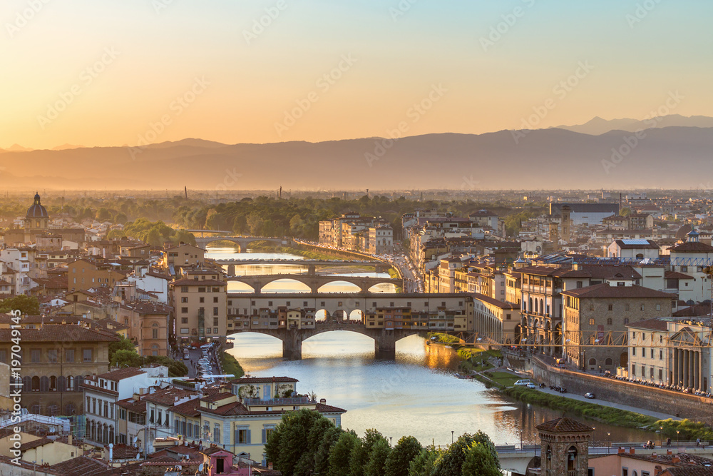 City of Florence at sunset with the Ponte Vecchio bridge