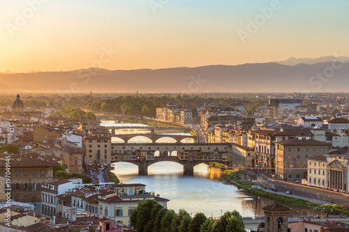 City of Florence at sunset with the Ponte Vecchio bridge