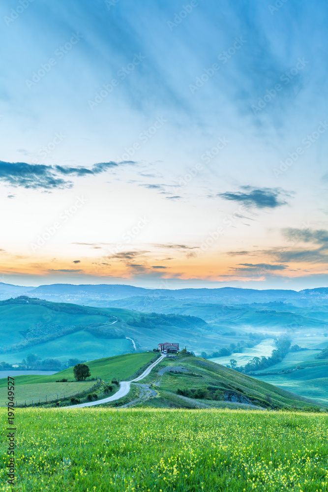 Fototapeta premium Landscape View in morning light with house on a hill