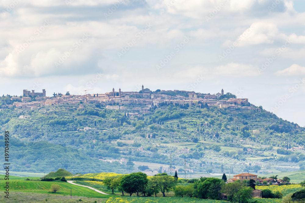 View towards the village of Montalcino on a hill in Italy