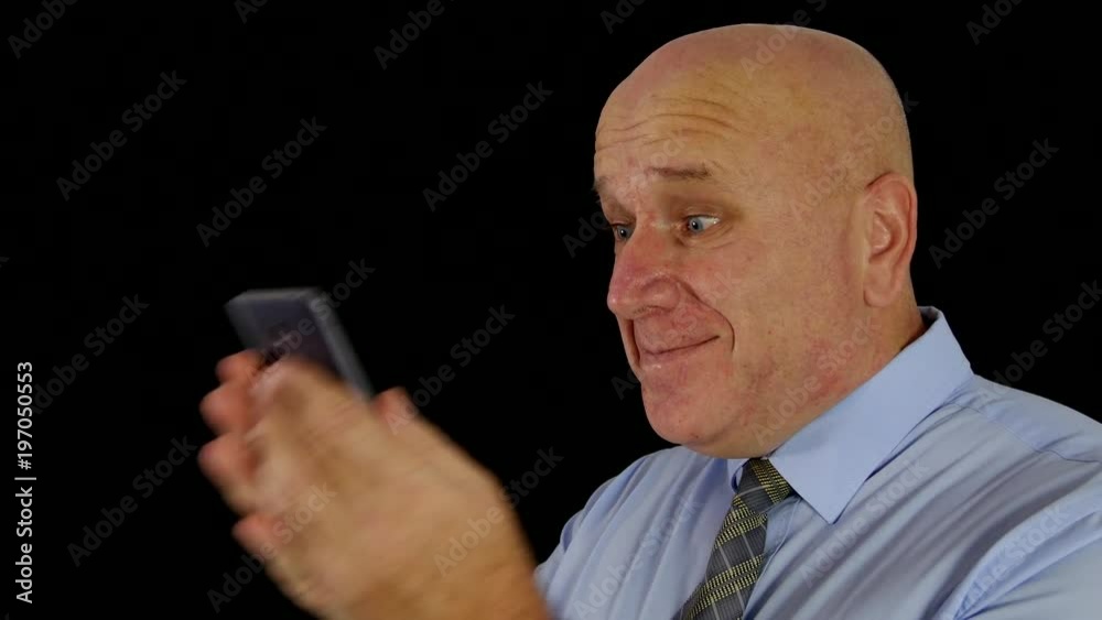 Happy Businessman Reading Good News on Mobile Make Winner Gestures Happy Businessman Reading Good News on Mobile Make Winner Gestures