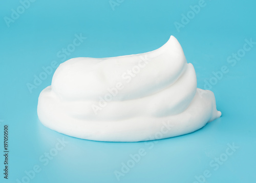 Soap foam bubble isolated on blue background object beatuy health care concept