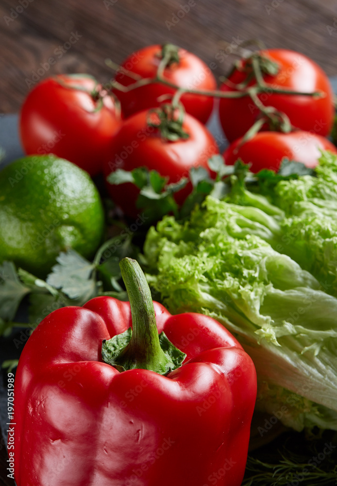 Close-up still life of assorted fresh vegetables and herbs on vintage wooden background, top view, selective focus. Close-up still life of assorted fresh vegetables and herbs on vintage wooden background, top view, selective focus.