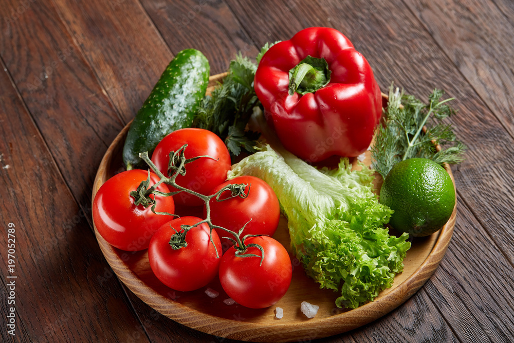 Close-up still life of assorted fresh vegetables and herbs on vintage wooden background, top view, selective focus. Close-up still life of assorted fresh vegetables and herbs on vintage wooden background, top view, selective focus.