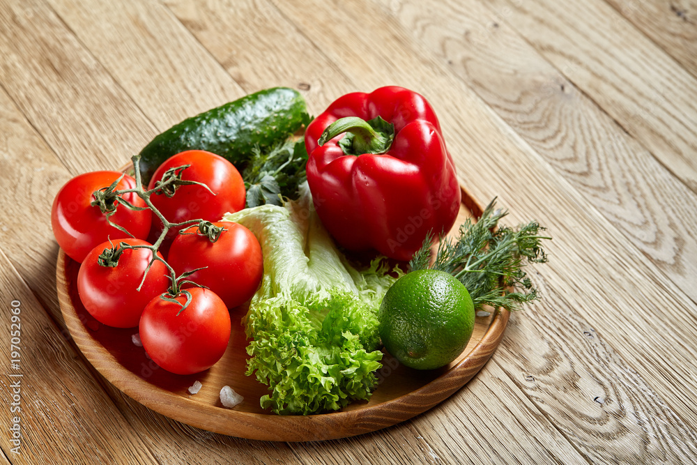 Close-up still life of assorted fresh vegetables and herbs on vintage wooden background, top view, selective focus. Close-up still life of assorted fresh vegetables and herbs on vintage wooden background, top view, selective focus.