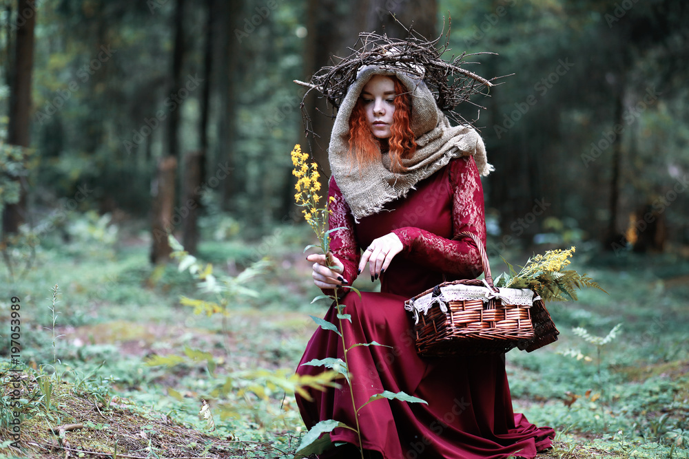 The red-haired witch holds a ritual with a crystal ball