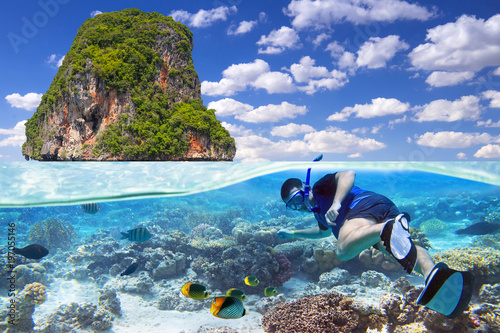 Man at snorkeling in the tropical water