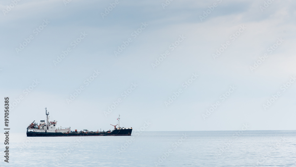 Industrial cargo ships anchored in the ocean