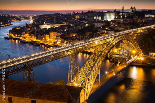 Night view of the historic city of Porto, Portugal with the Dom Luiz bridge