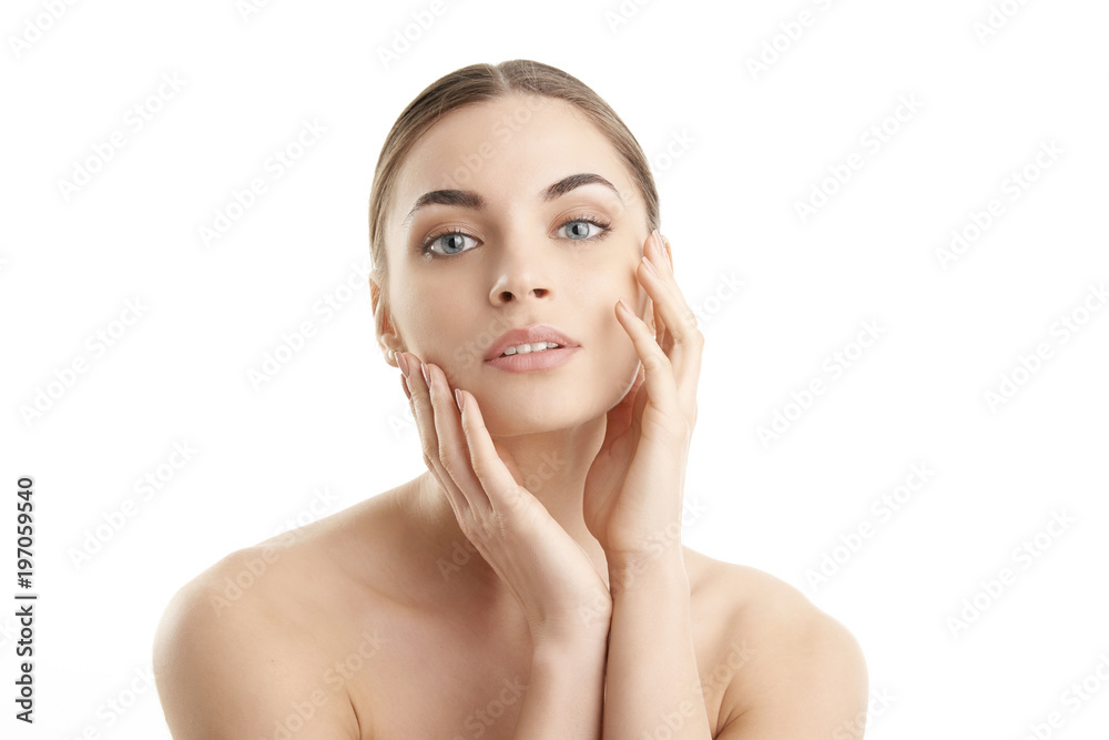 Healthy glowing skin. Portrait of beautiful young woman with toothy smile and radiant skin posing at isolated white background. Healthy glowing skin. Portrait of beautiful young woman with toothy smile and radiant skin posing at isolated white background.