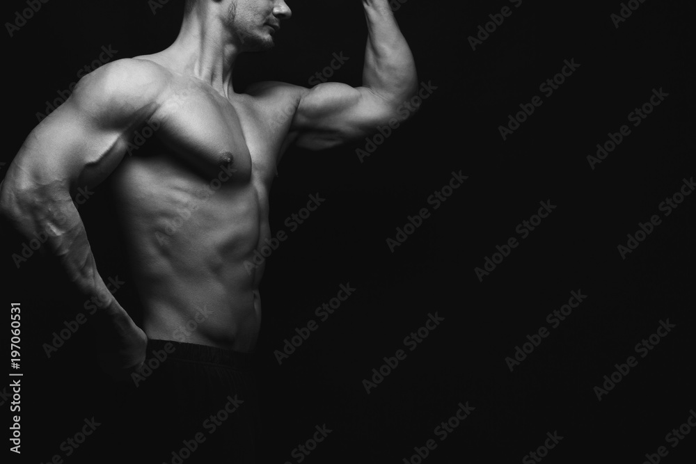 Strong athletic man showes naked muscular body Strong athletic man showes naked muscular body