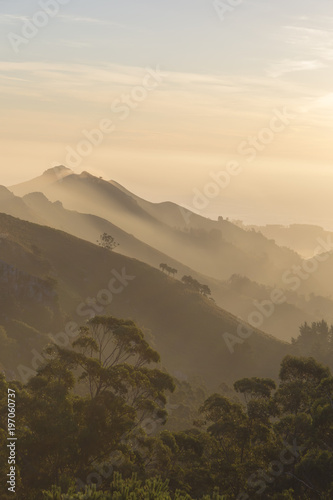 View of foggy mountains.Fog covering the mountain forests. Dawn.