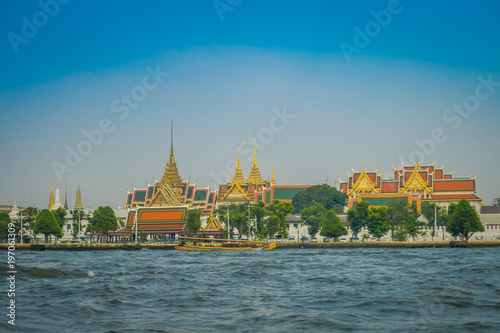 Outdoor view of Wat Pho or Wat Phra Chetuphon, 'Wat' means temple in Thai located in the horzont. The temple is one of Bangkok's most famous tourist sites in Thailand