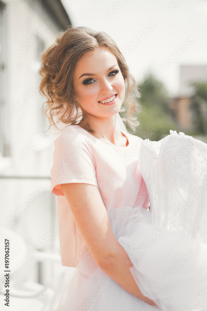 Portrait of beautiful bride with fashion veil at wedding morning Portrait of beautiful bride with fashion veil at wedding morning
