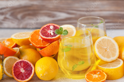 Detox citrus water, refreshing summer homemade lemonade cocktail with lemon and orange