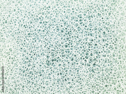 White and gray macro texture cellulose foam sponge. Abstract sponge background. Close-up photo