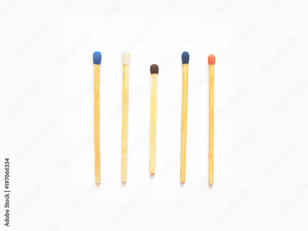 Wooden matches with heads of different colors. Five match sticks isolated on white background, close-up. Berthollet salt, sulfur Wooden matches with heads of different colors. Five match sticks isolated on white background, close-up. Berthollet salt, sulfur