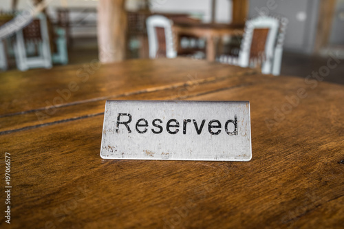 reserved sign on table in restaurant closeup