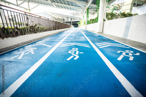 blue concrete runway, walkway and jogging way photo