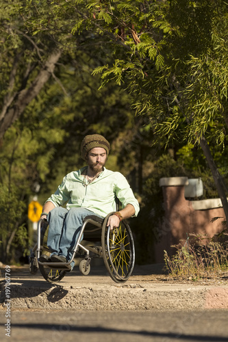 Man in Wheelchair at City Curb © Scott Griessel