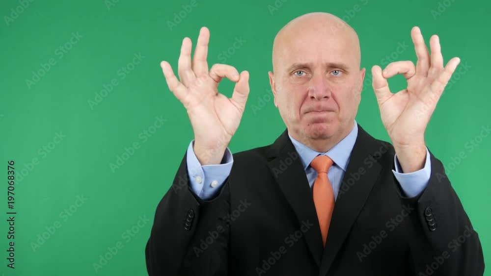 Serious Businessman Make Ok Sign with Both Hands Serious Businessman Make Ok Sign with Both Hands
