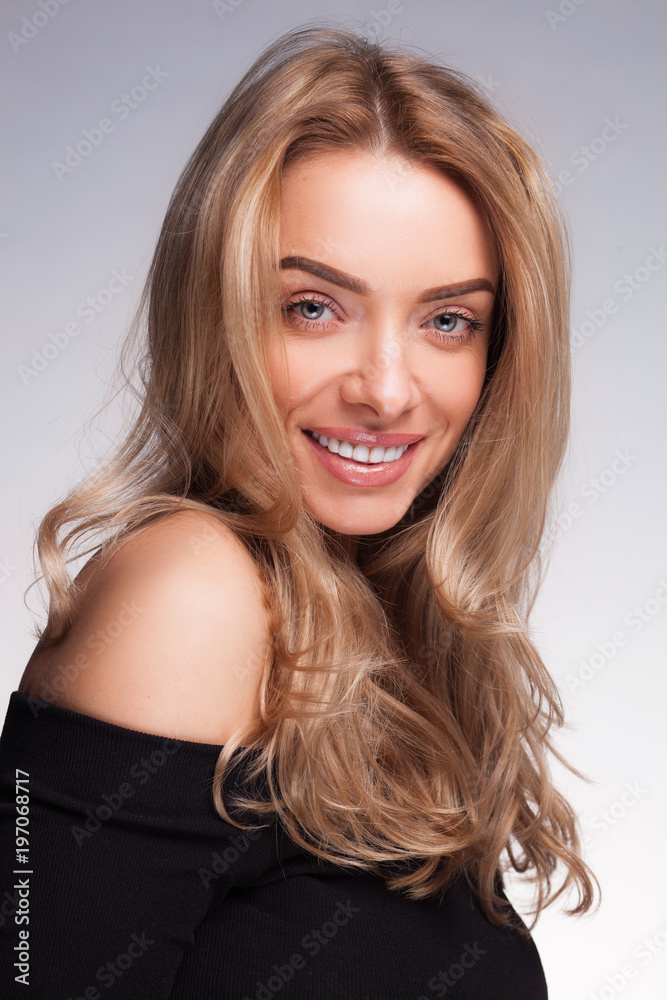closeup portrait of beautyful blond smiling woman with clean fresh skin