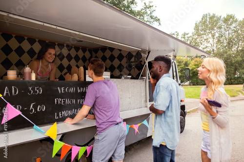 happy customers queue at food truck