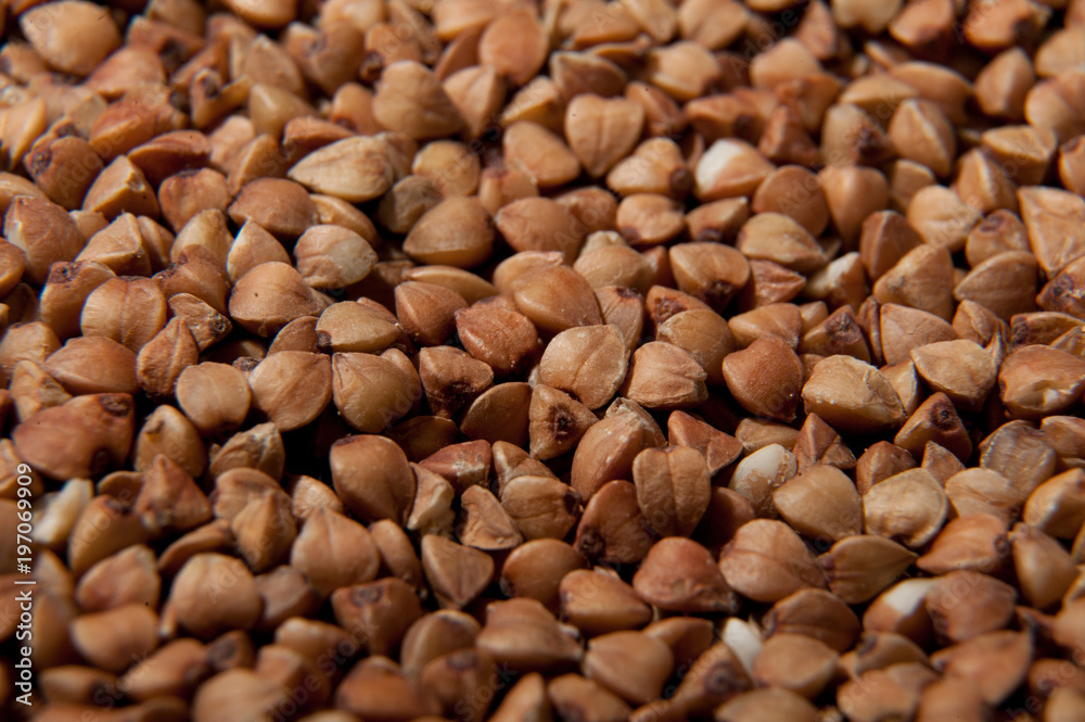 Buckwheat grains background - healthy food with vitamins Buckwheat grains background - healthy food with vitamins