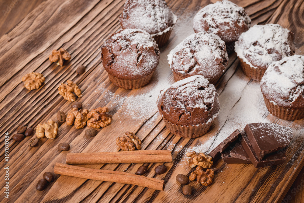Fotografie chocolate muffins on a wooden table