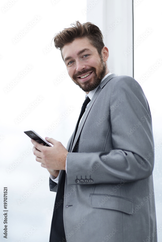 Stylish man in suit is reading information on phone Stylish man in suit is reading information on phone
