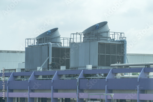 Cooling towers on daylight on the purple floor